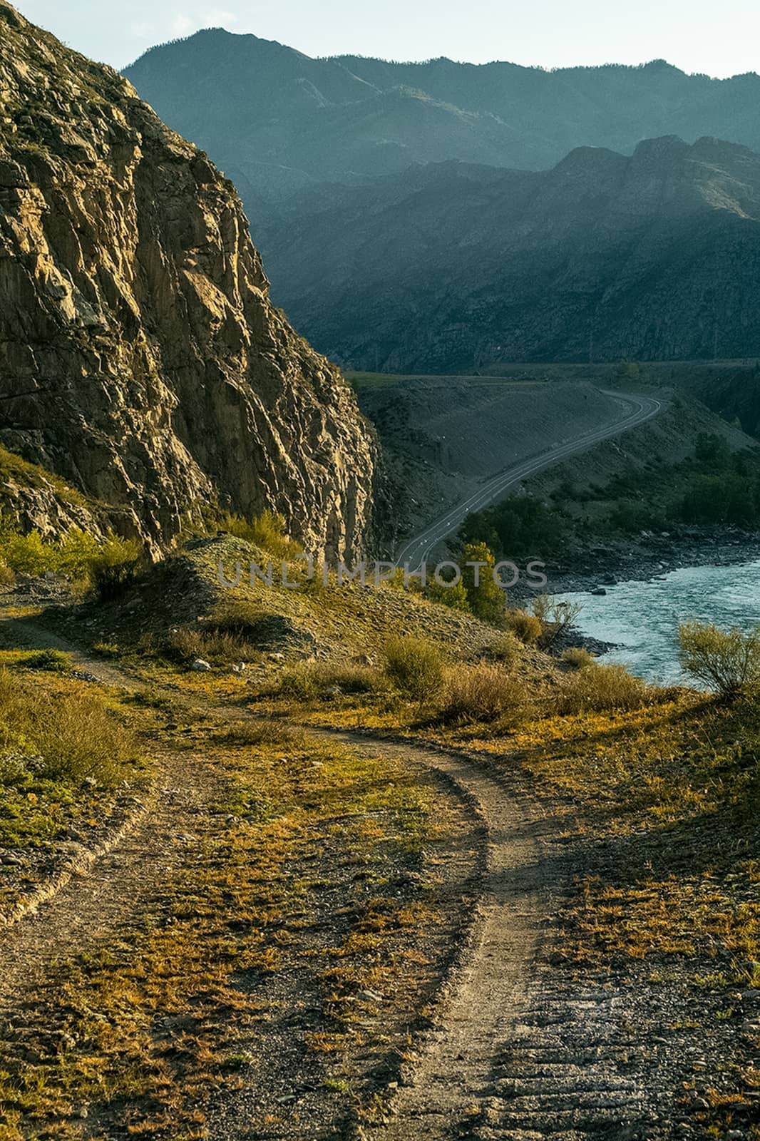 Asphalt road to the mountains. Mountain track on the Altai.