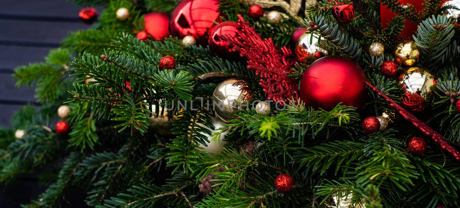 Christmas festive composition with balls and decor on stone background with copy space