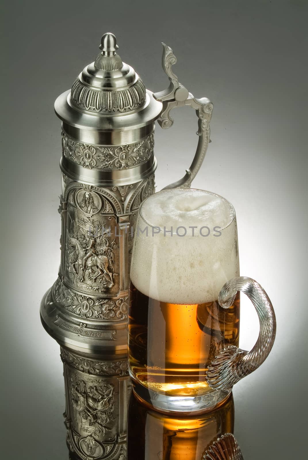 Mug of beer on a glass background