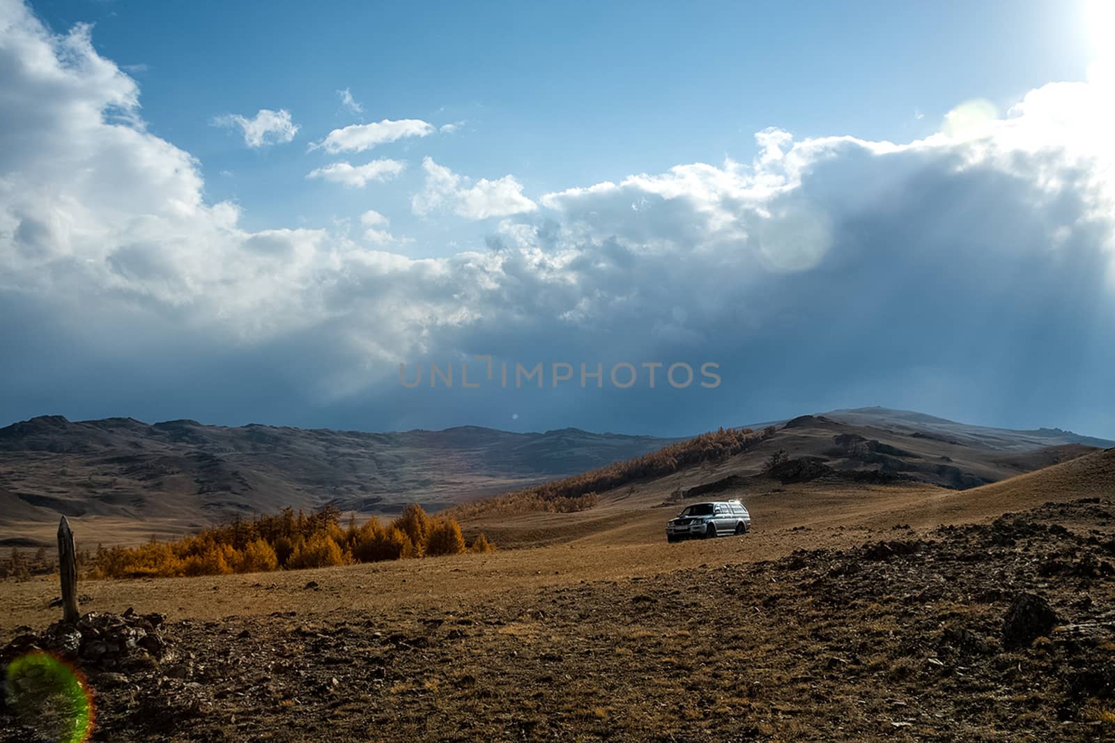 SUV against the background of the mountain landscape. Travelling in an SUV