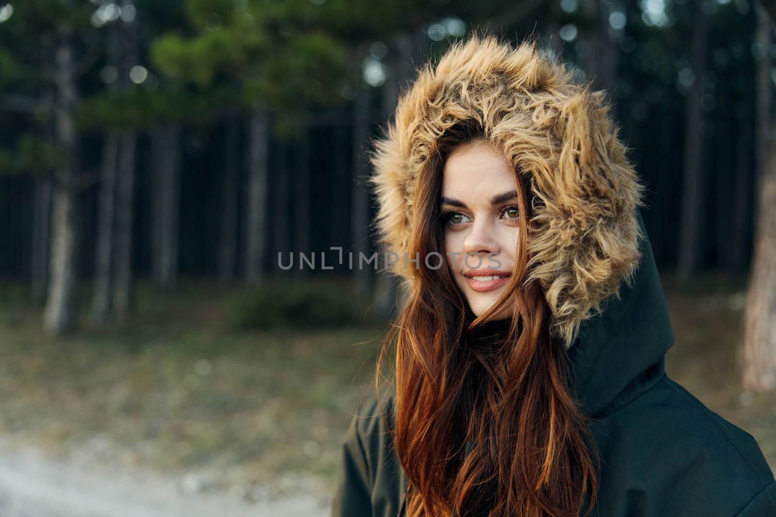 Woman tourist in autumn jacket with a hood on nature travel vacation by SHOTPRIME