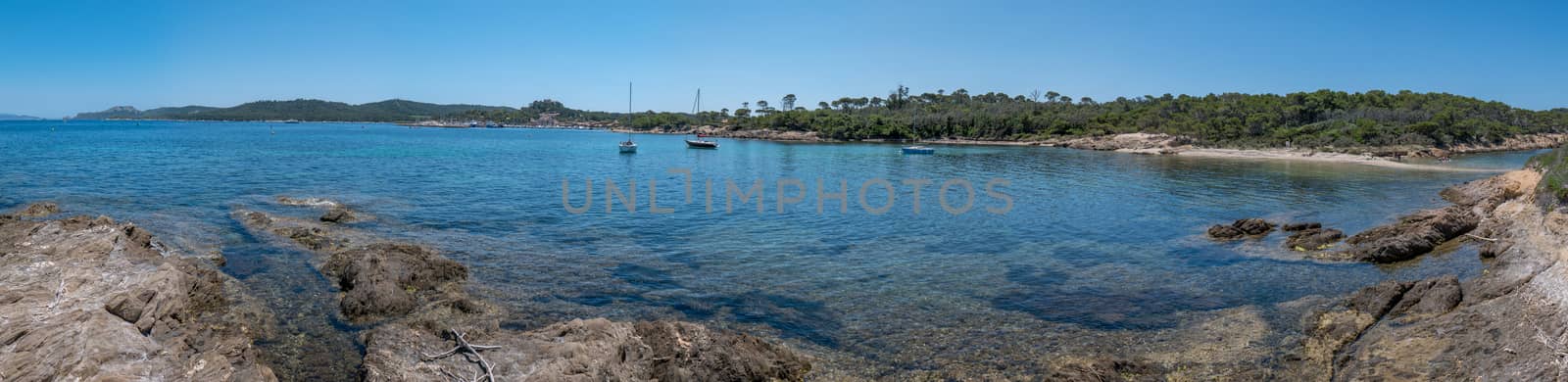 Discovery of the island of Porquerolles in summer. Deserted beaches and pine trees in this landscape of the French Riviera, Var.