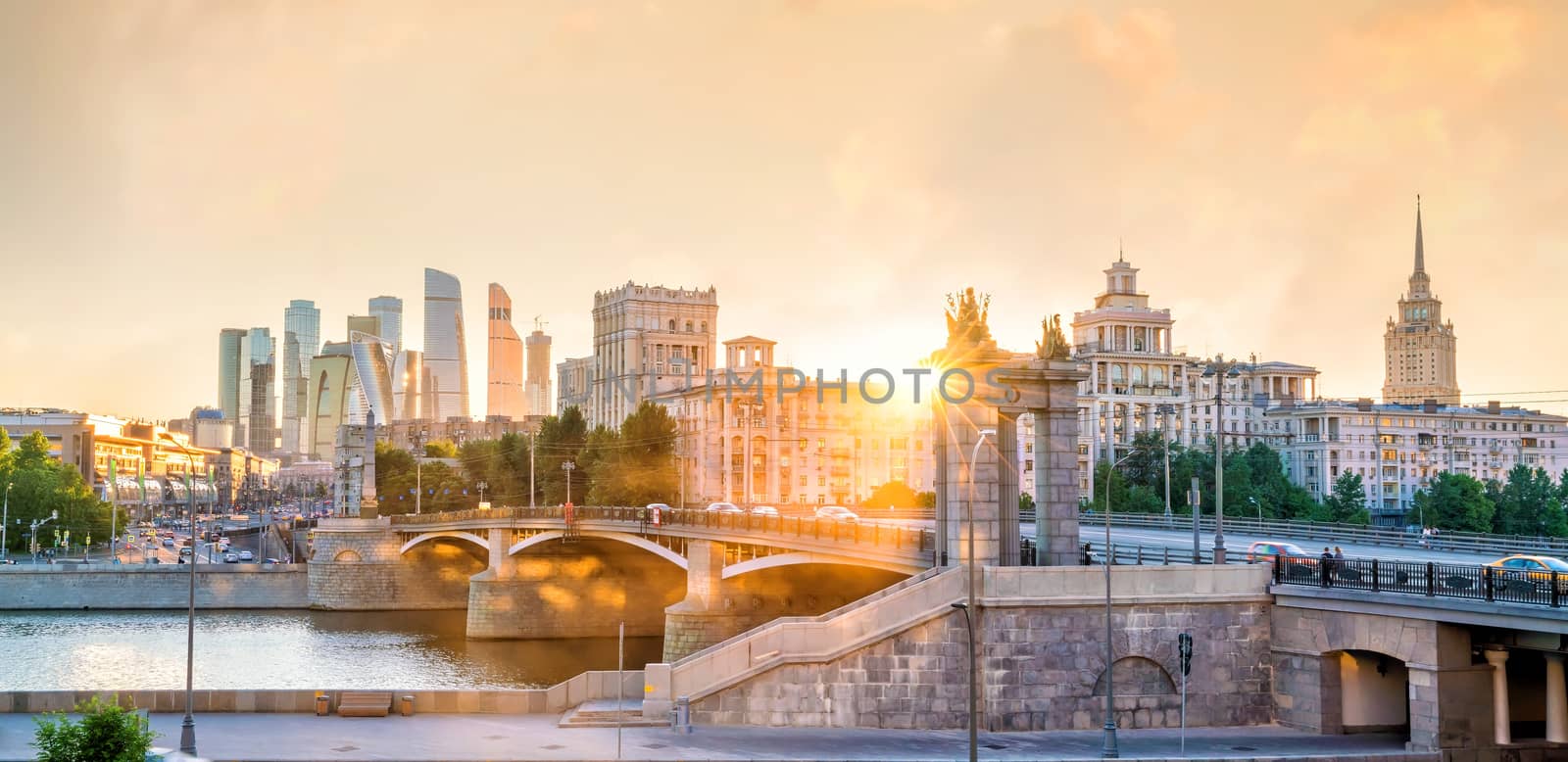 Moscow City skyline business district and Moscow River in Russia at sunset