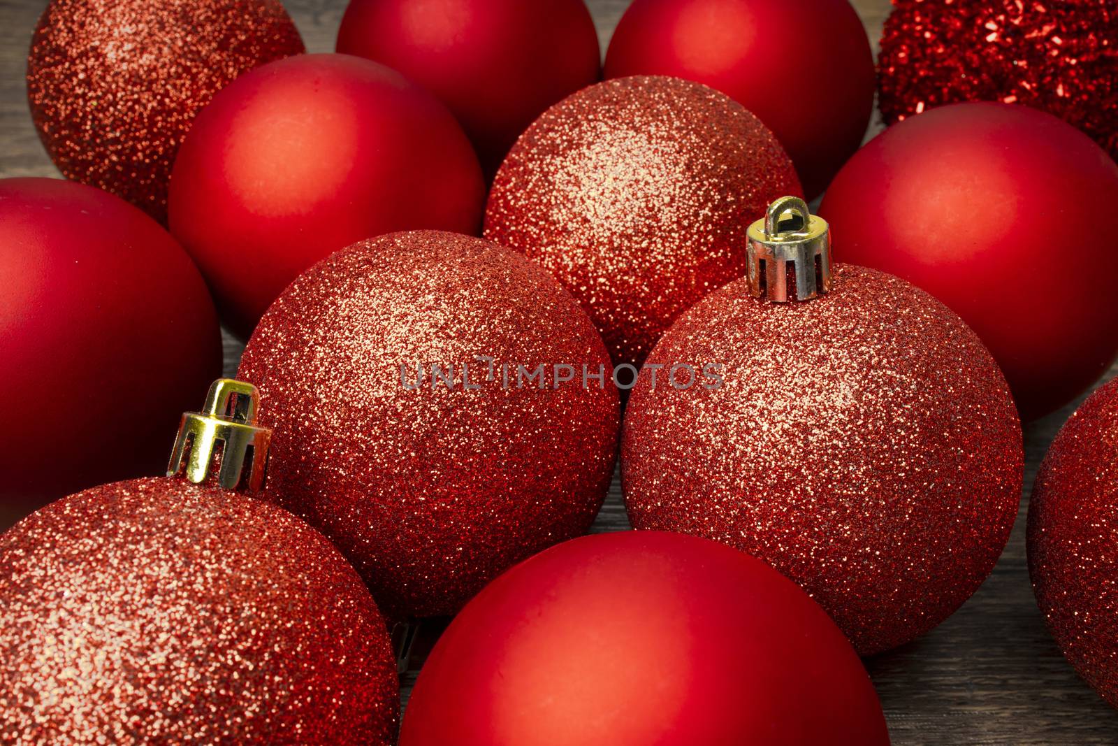 Red Christmas ornamental baubles closeup.