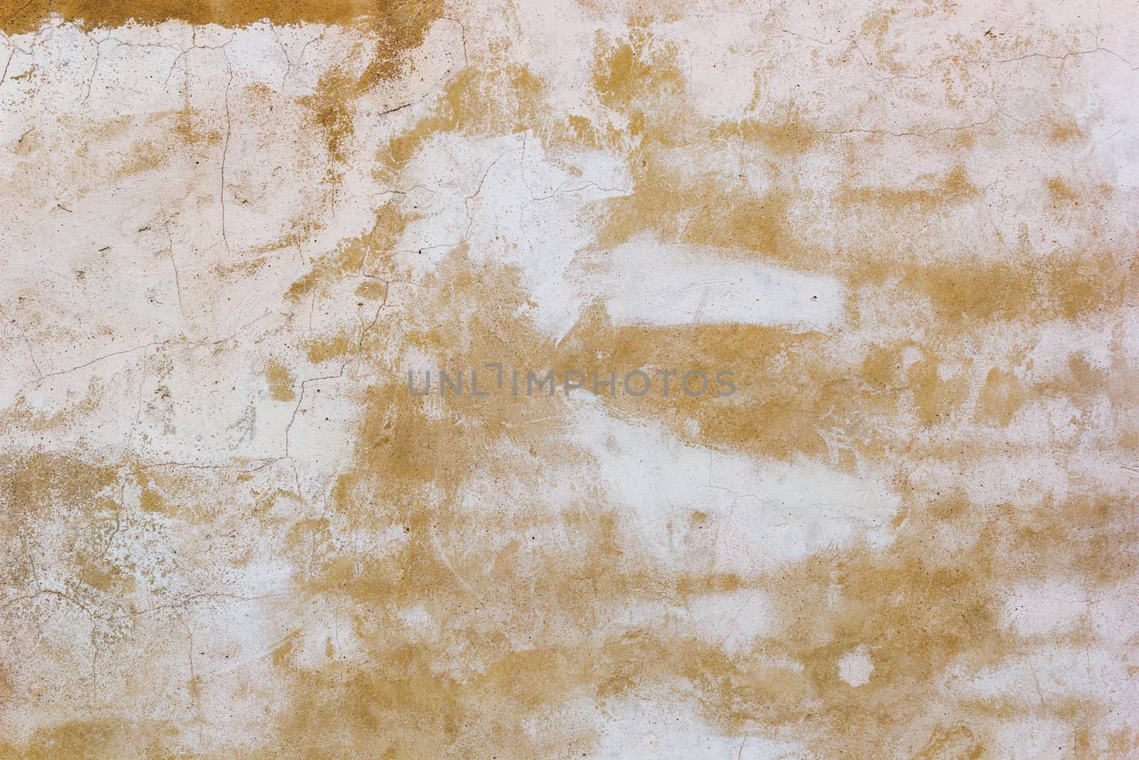 Yellow and white plaster wall background with cracks