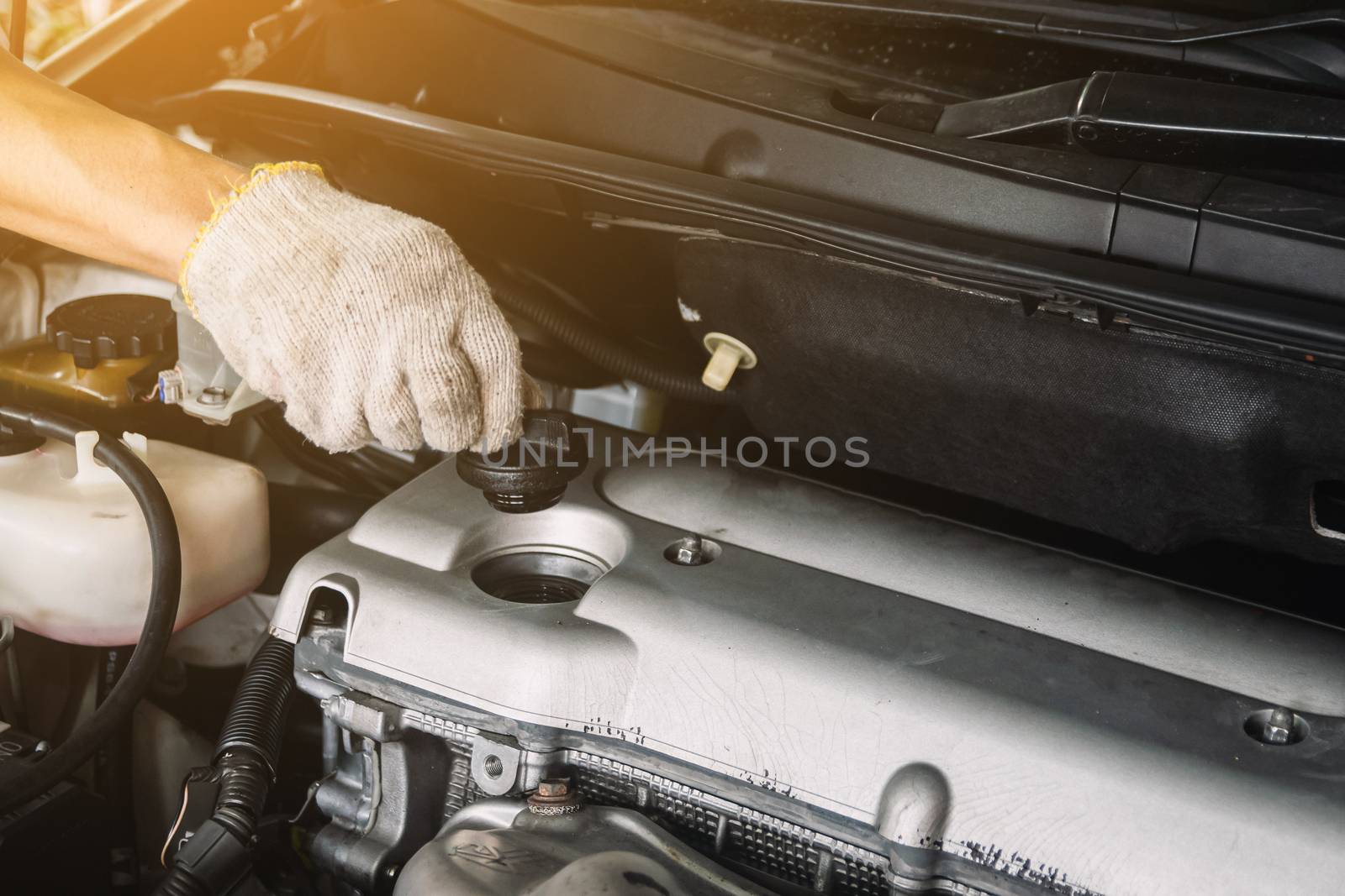 Auto mechanic Repair maintenance Check engine oil level and car inspection