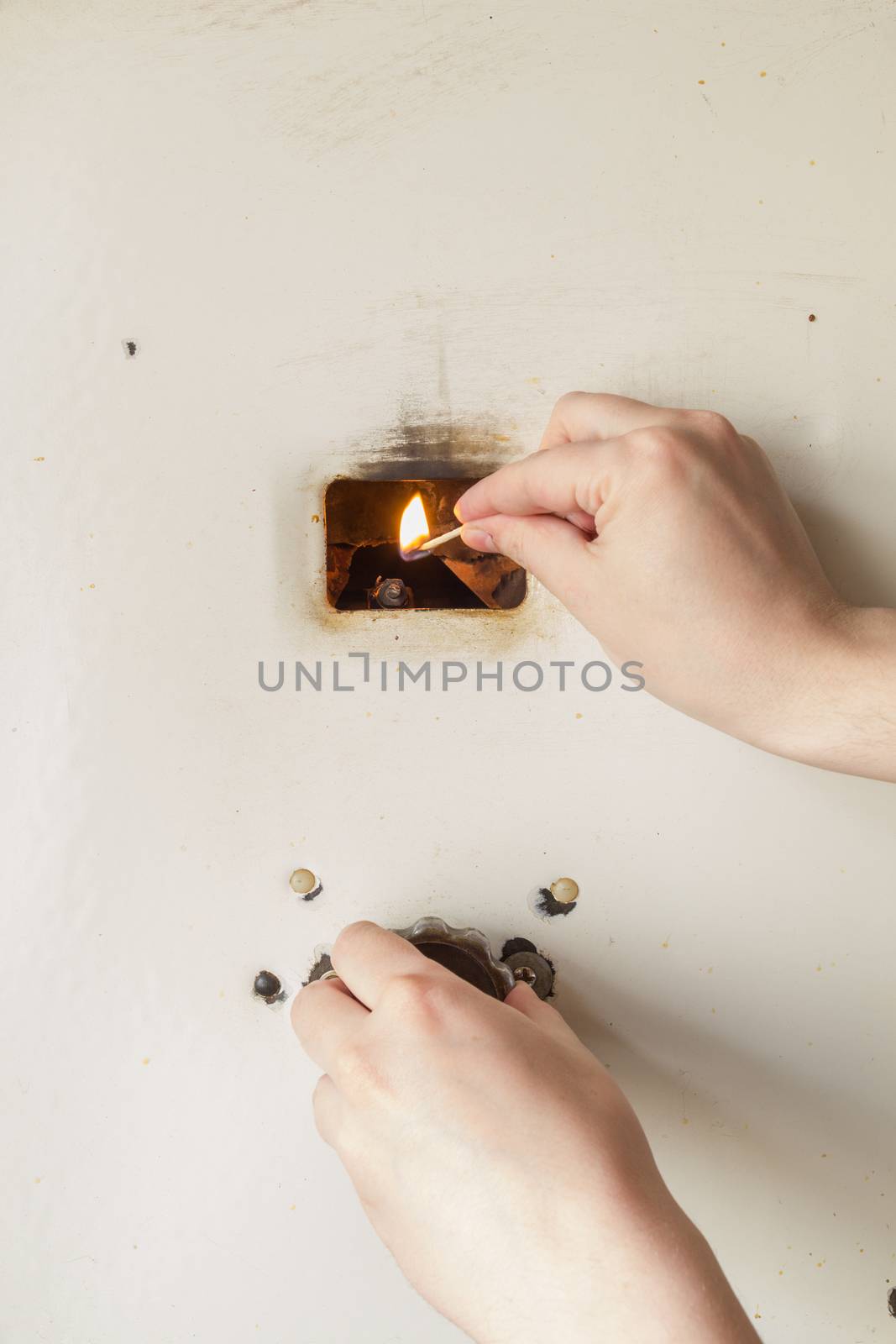 Manually firing up  old russian gas water heater with flat front panel