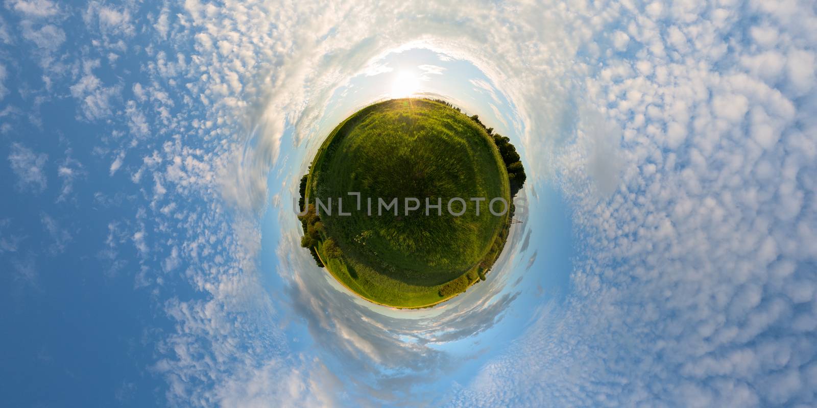 Sunset on meadow little planet panorama with 2 by 1 aspect ratio.