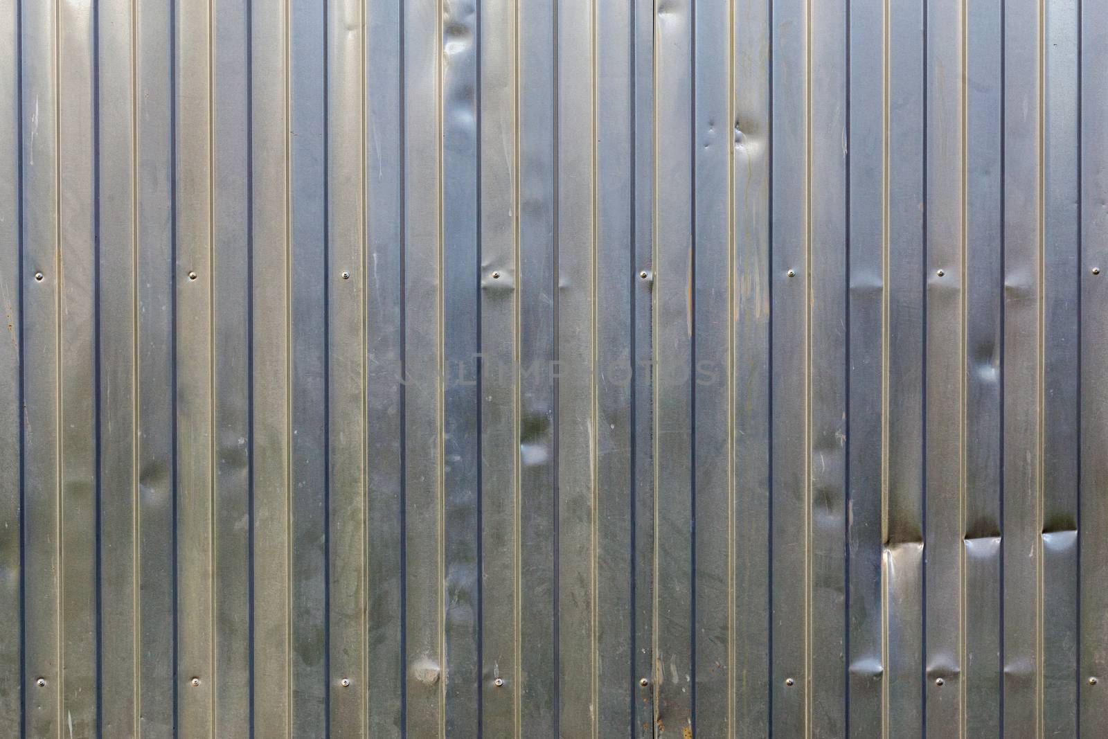 dusty galvanized profiled sheet flat background with vertical direction of rolling and landscape orientation of picture