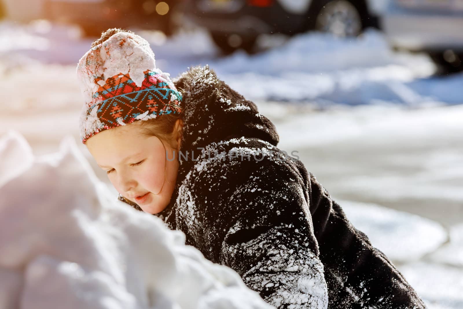 Snow on home drive way little child play outdoors on snowy by ungvar