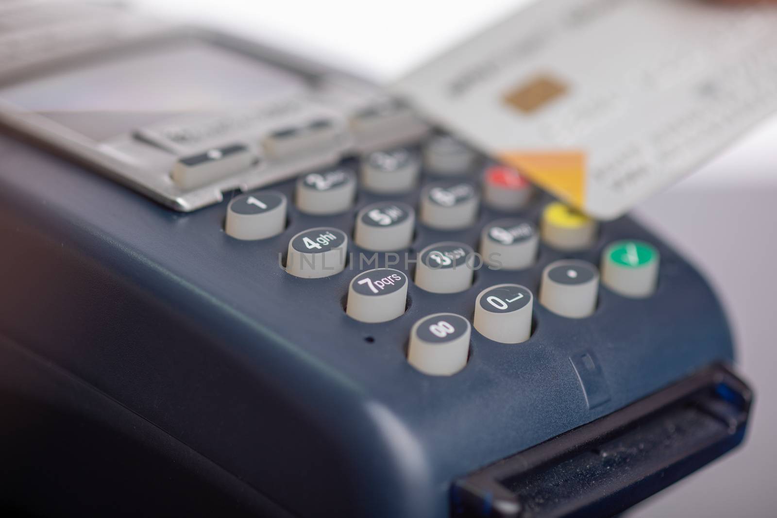 Payment by contactless credit card through the POS terminal stock photo