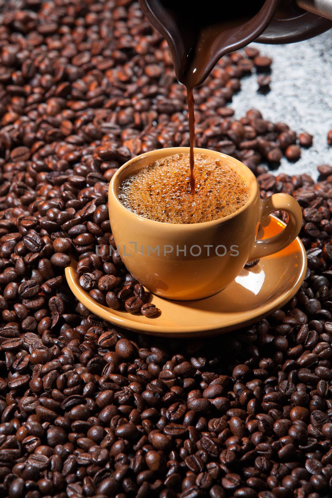 Coffee and coffee beans ona studio background