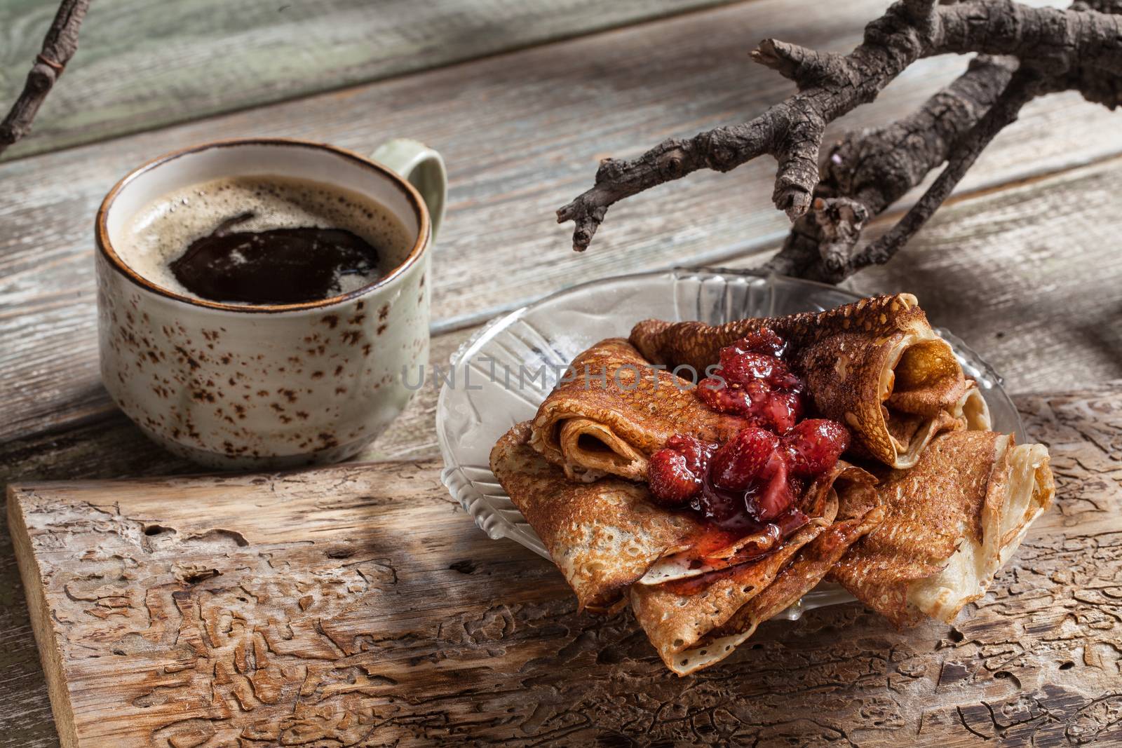 Pancakes on an old studio wooden background