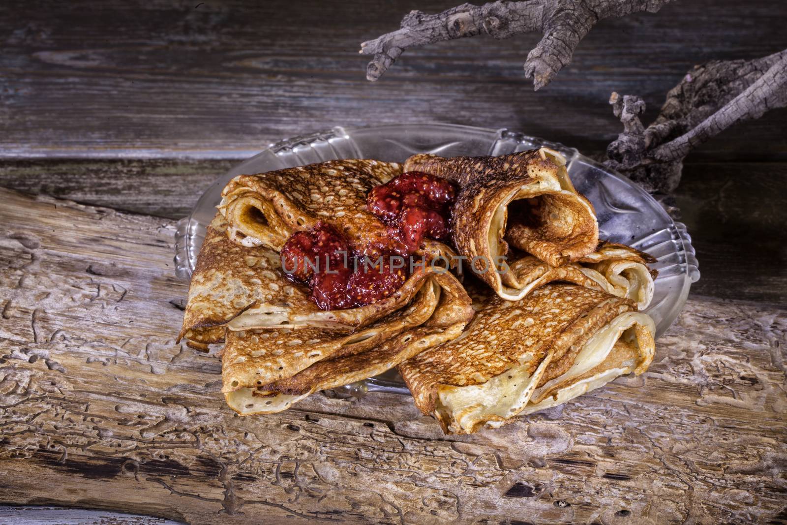 Pancakes on an old studio wooden background