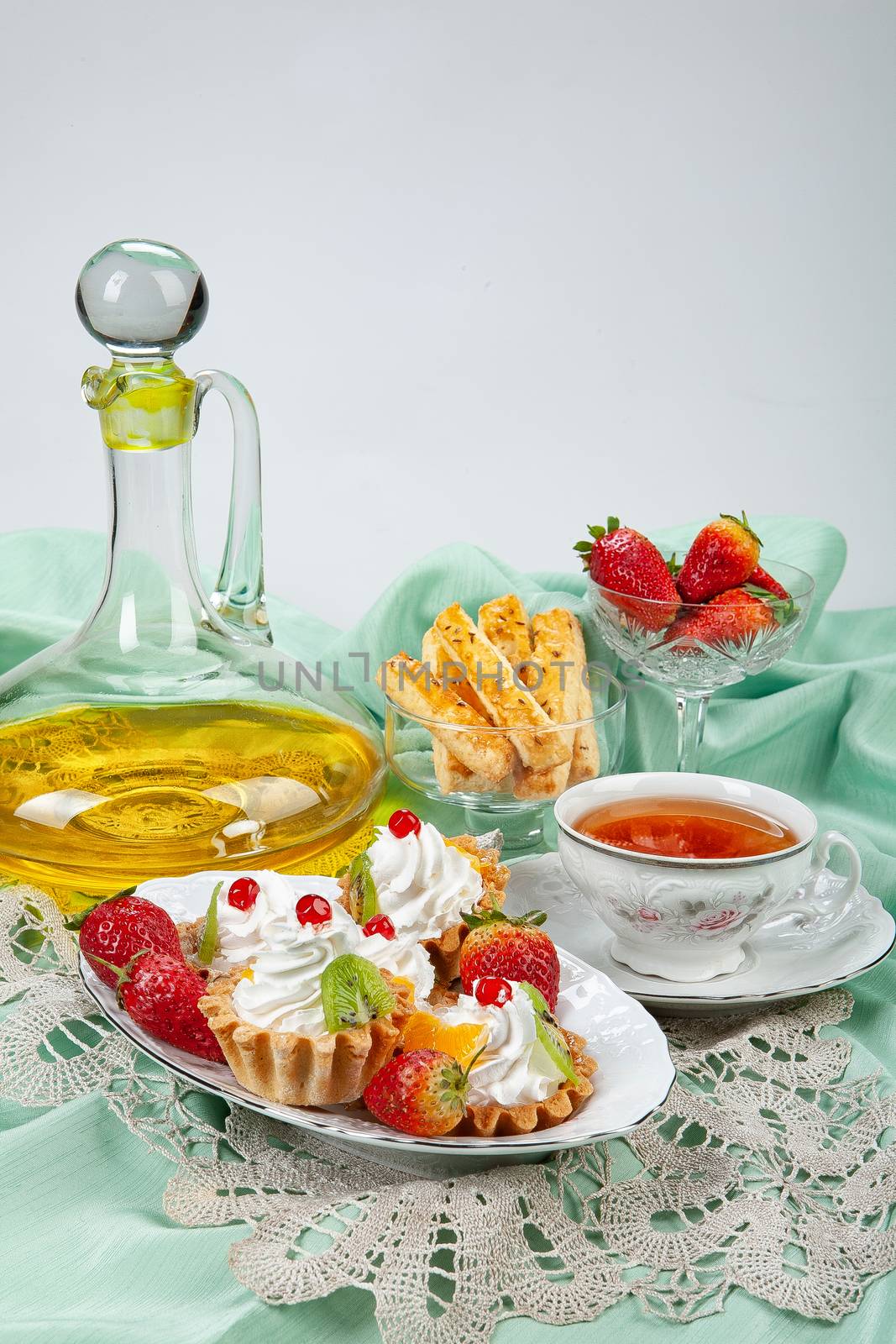 Still life with strawberries on a studio background