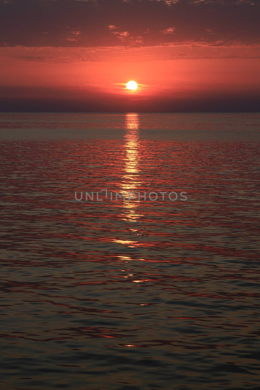 Sunset off the coast of the Greek island of Mykonos.