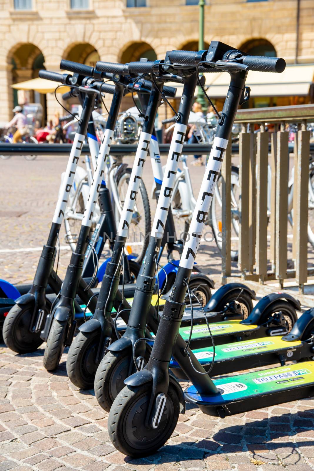 Verona, Veneto/Italy - 18.08.2020: Several e-scooters for rent in Verona so that tourists and visitors can cover distances on the e-scooter and do not have to walk.