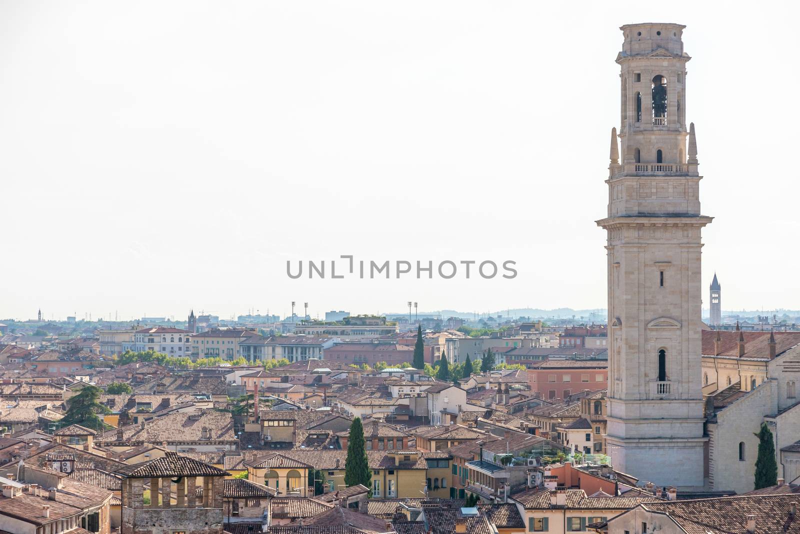 Verona, Veneto/Italy - 18.08.2020: View of Verona from above to the old town with a church tower in the foreground.