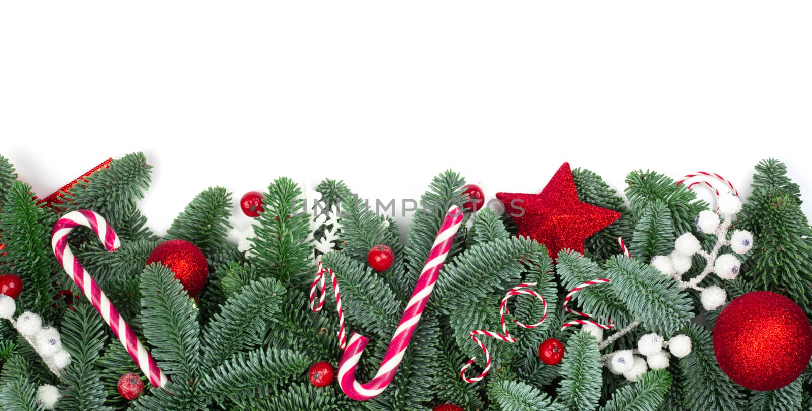 Christmas design boder frame greeting card of noble fir tree branches and baubles isolated on white background