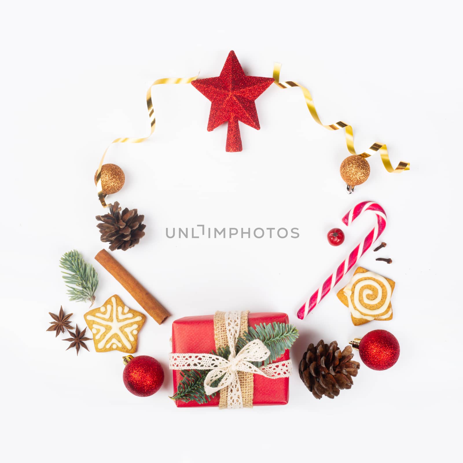 Minimalistic Christmas flat lay wreath composition of objects design top view on white background. New Year concept.