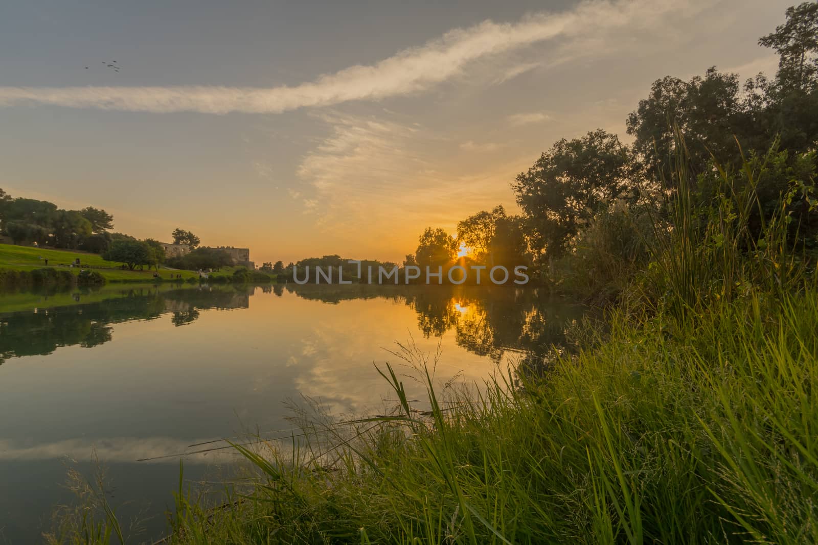 Sunset view of the lake, with the Antipatris Fort (Binar Bashi), in Yarkon (Tel Afek) National Park, central Israel