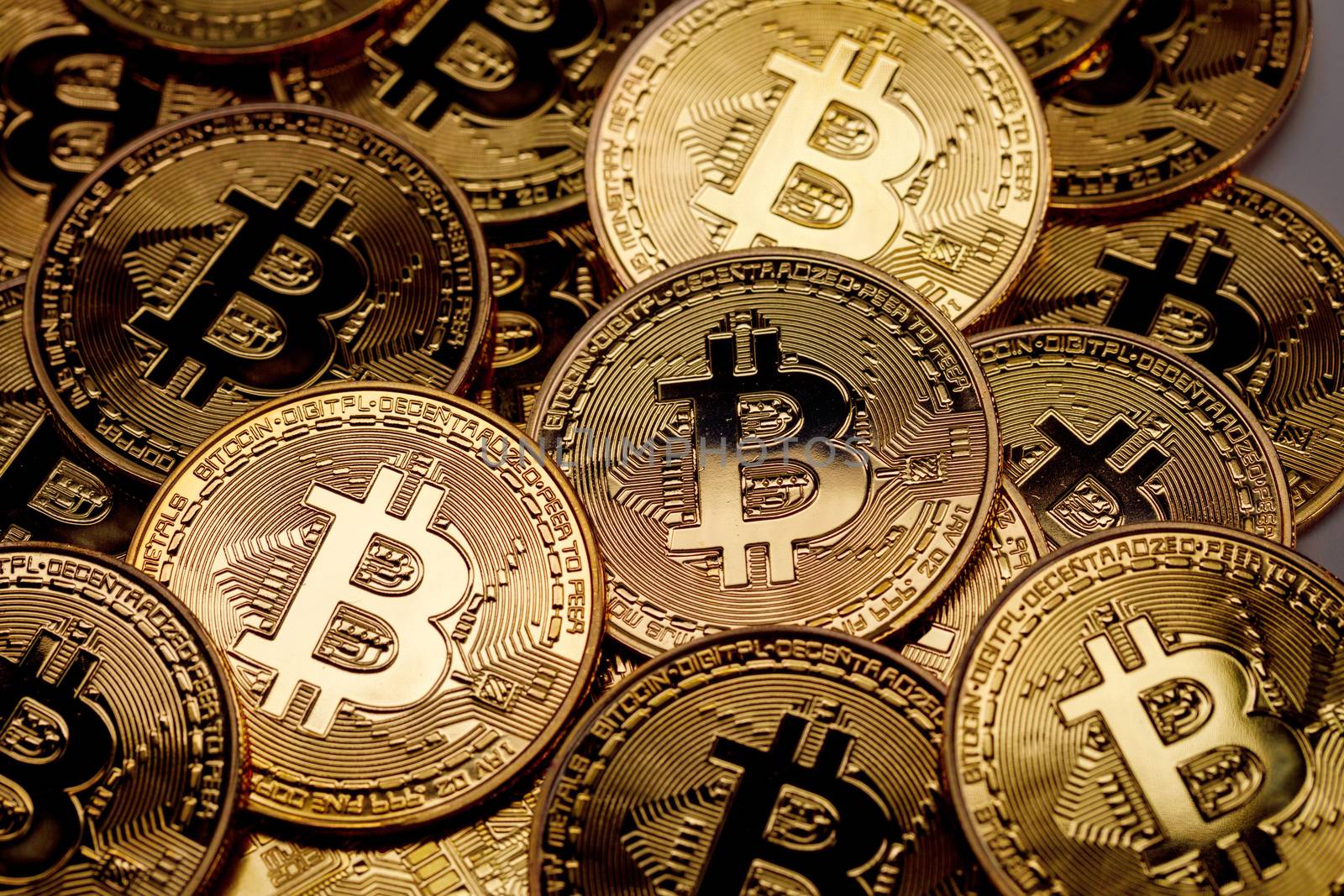 Background of gold coins with bitcoin sign