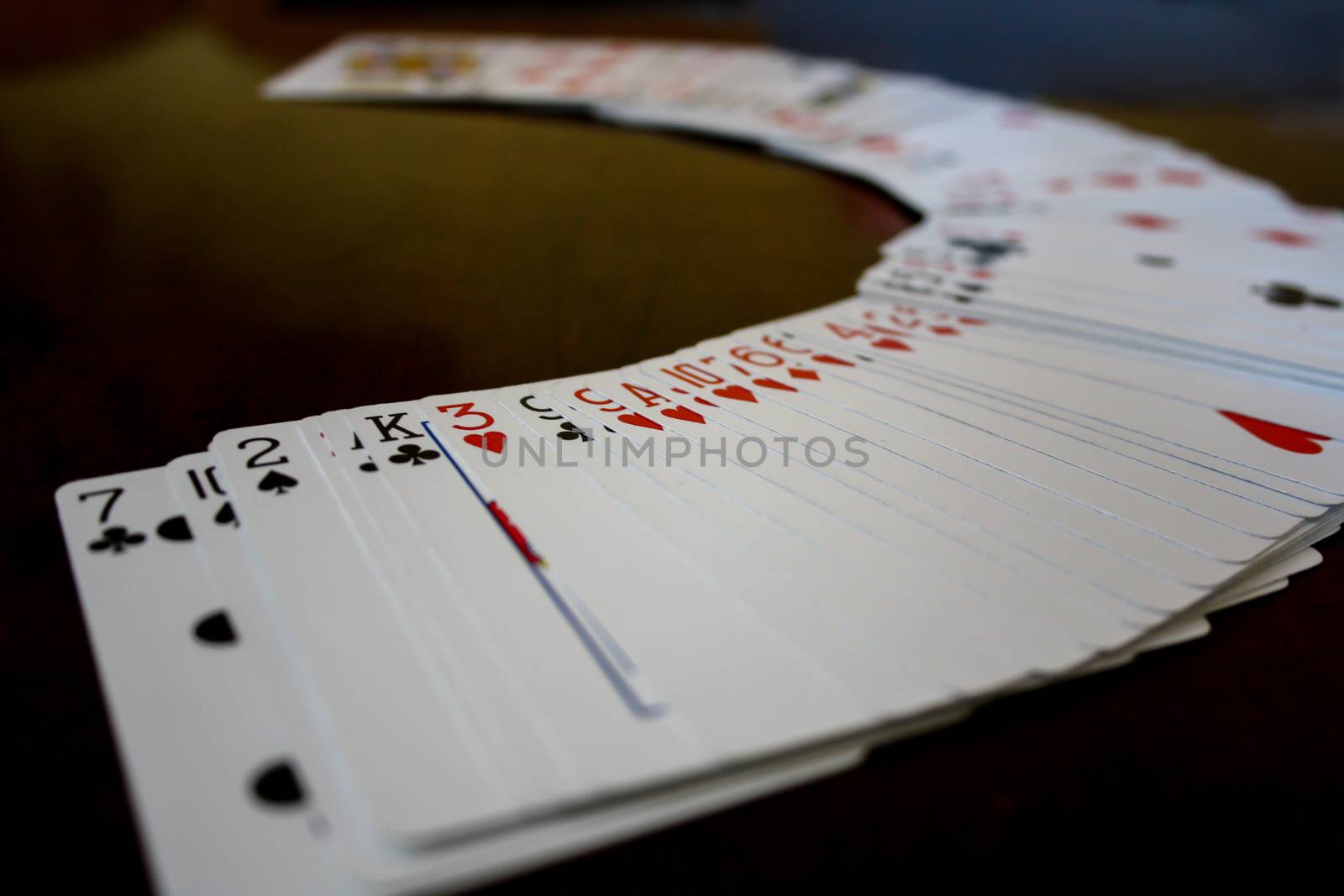 Playing cards arrange in a semi circle