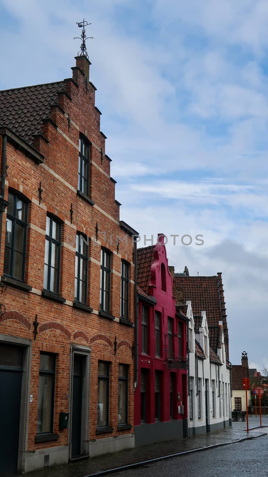 Bruges / Belgium - 03-08-2020: Characteristic Bruges architecture buildings by codrinn