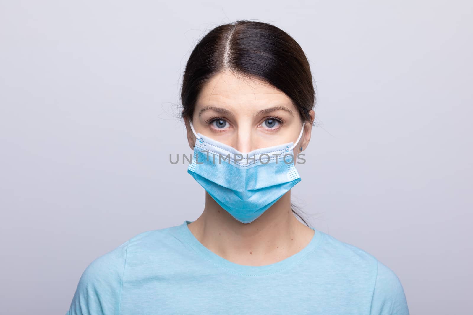 Worried nurse, doctor or scientist portrait behind facemask by adamr