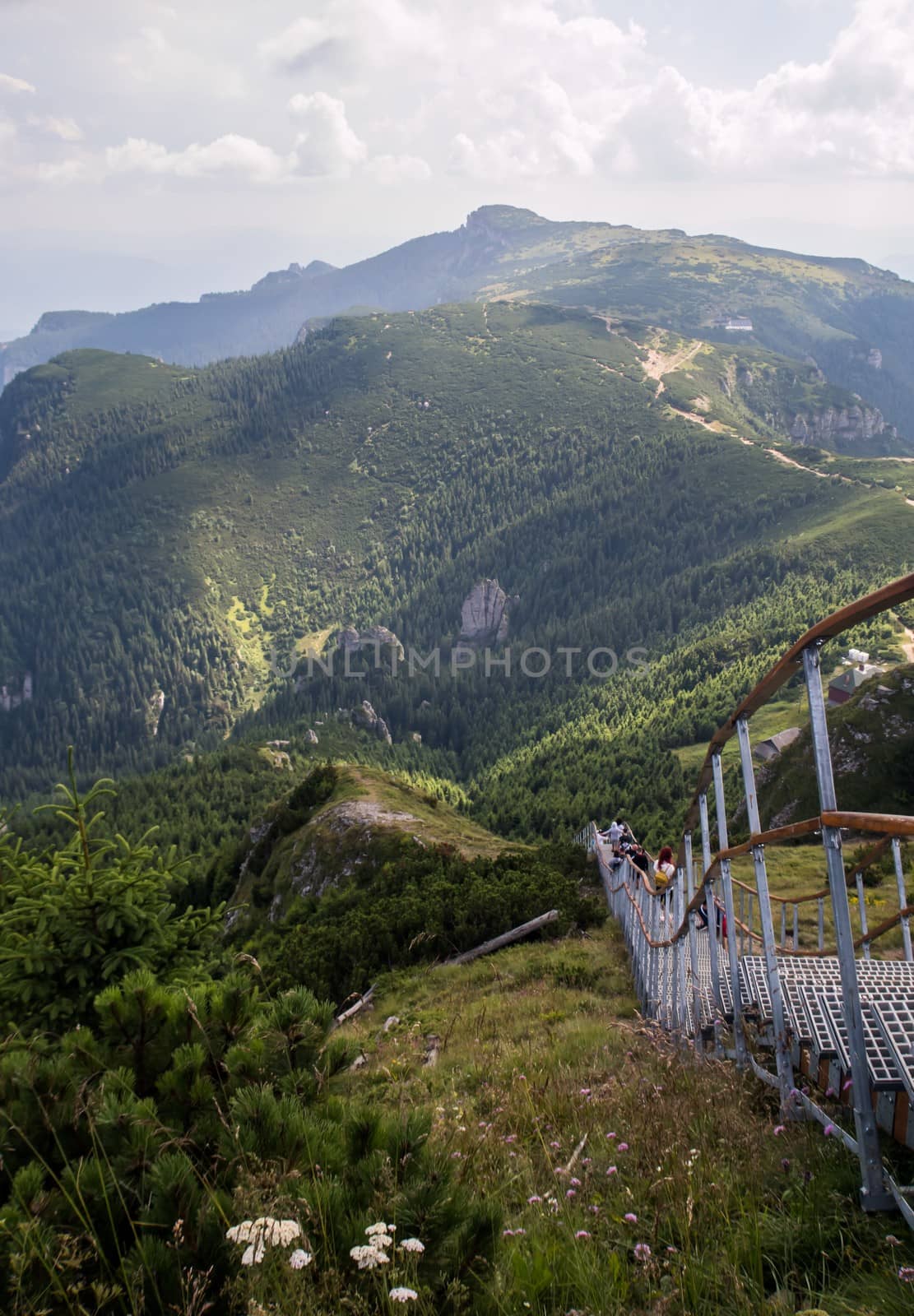 Staircase going down in the moutains - people on the mountain - landscape of mountains, Varful Toaca, Romania