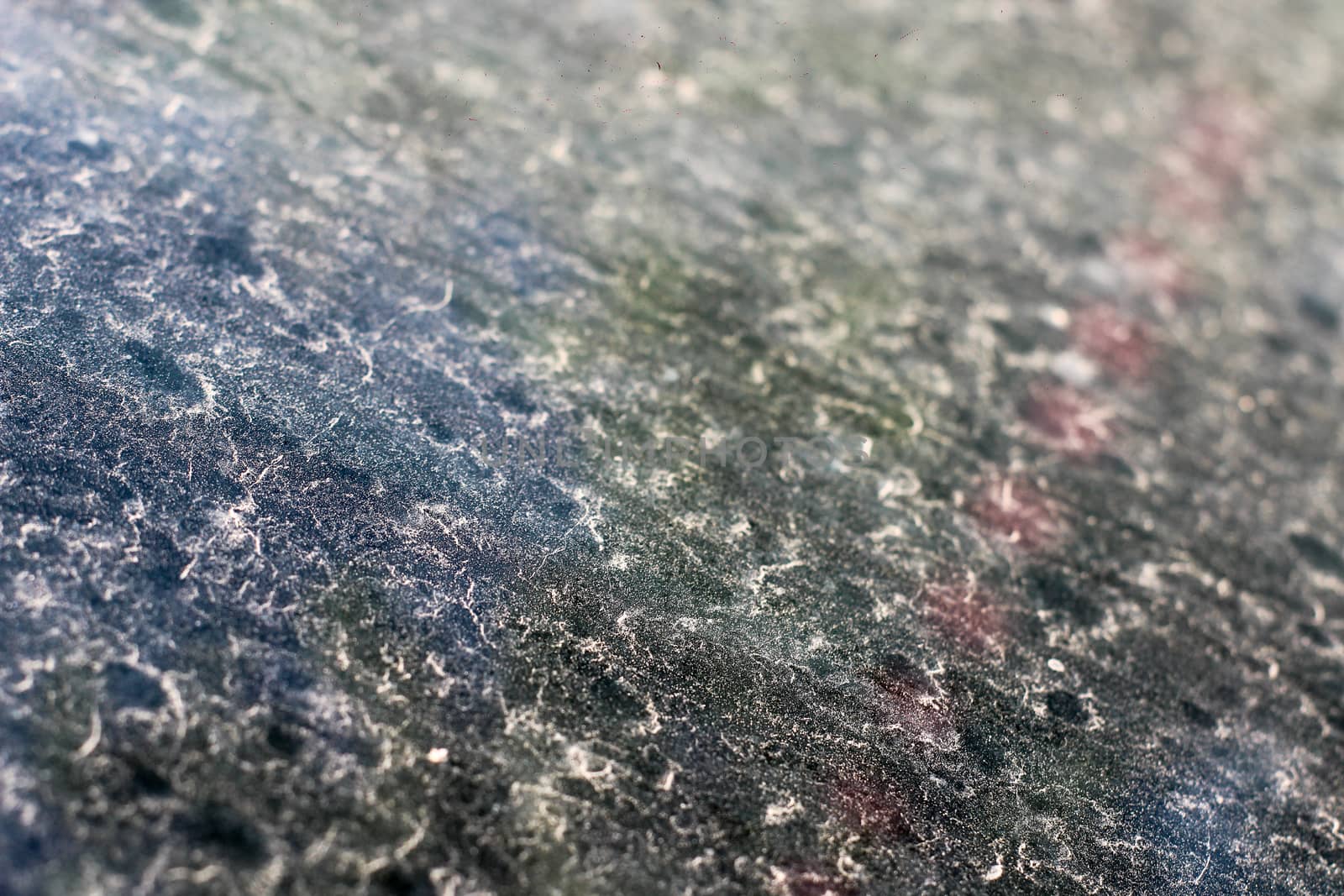 Sand on the windshield of a car - dust on window