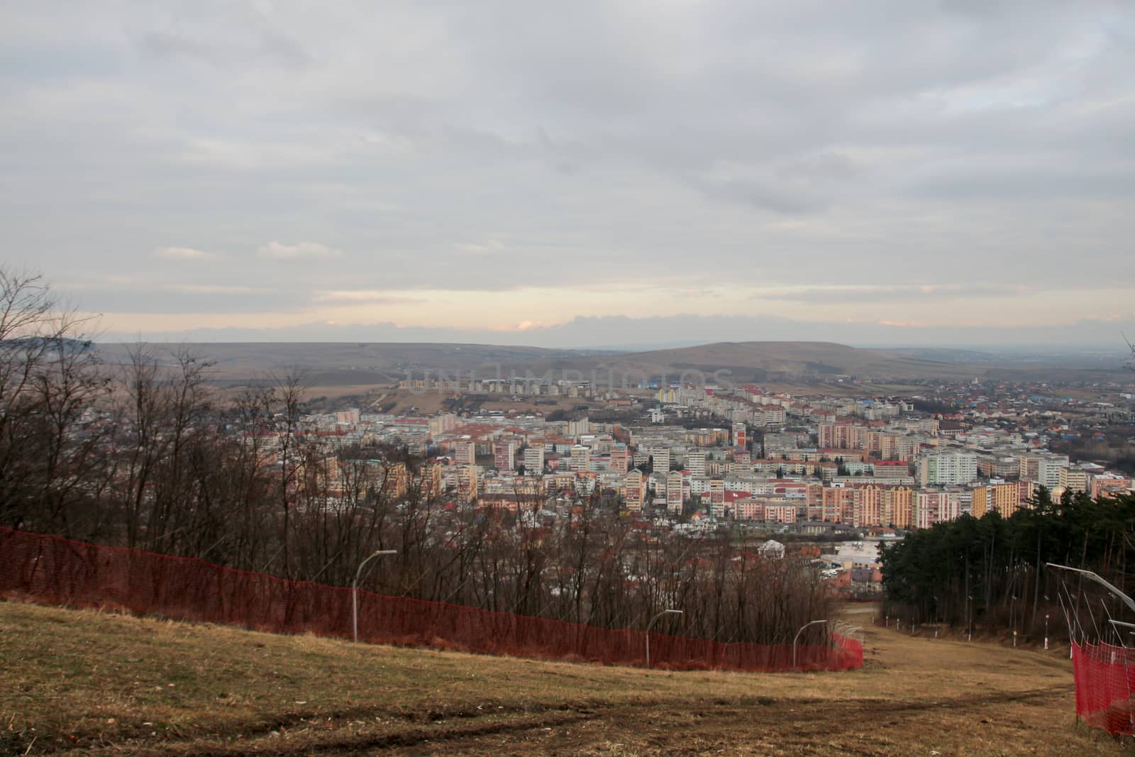 Landscape of city with apartment buildings seen from the hill by codrinn