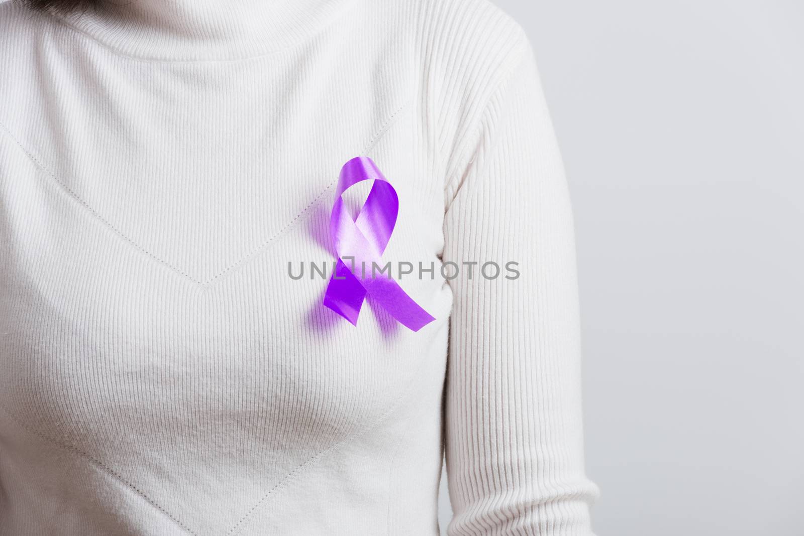 National Epilepsy or Alzheimer disease Day Concept. Young woman stick purple ribbon on the chest symbol of Pancreatic cancer, Epilepsy awareness and world Lupus Day and world cancer isolated white background