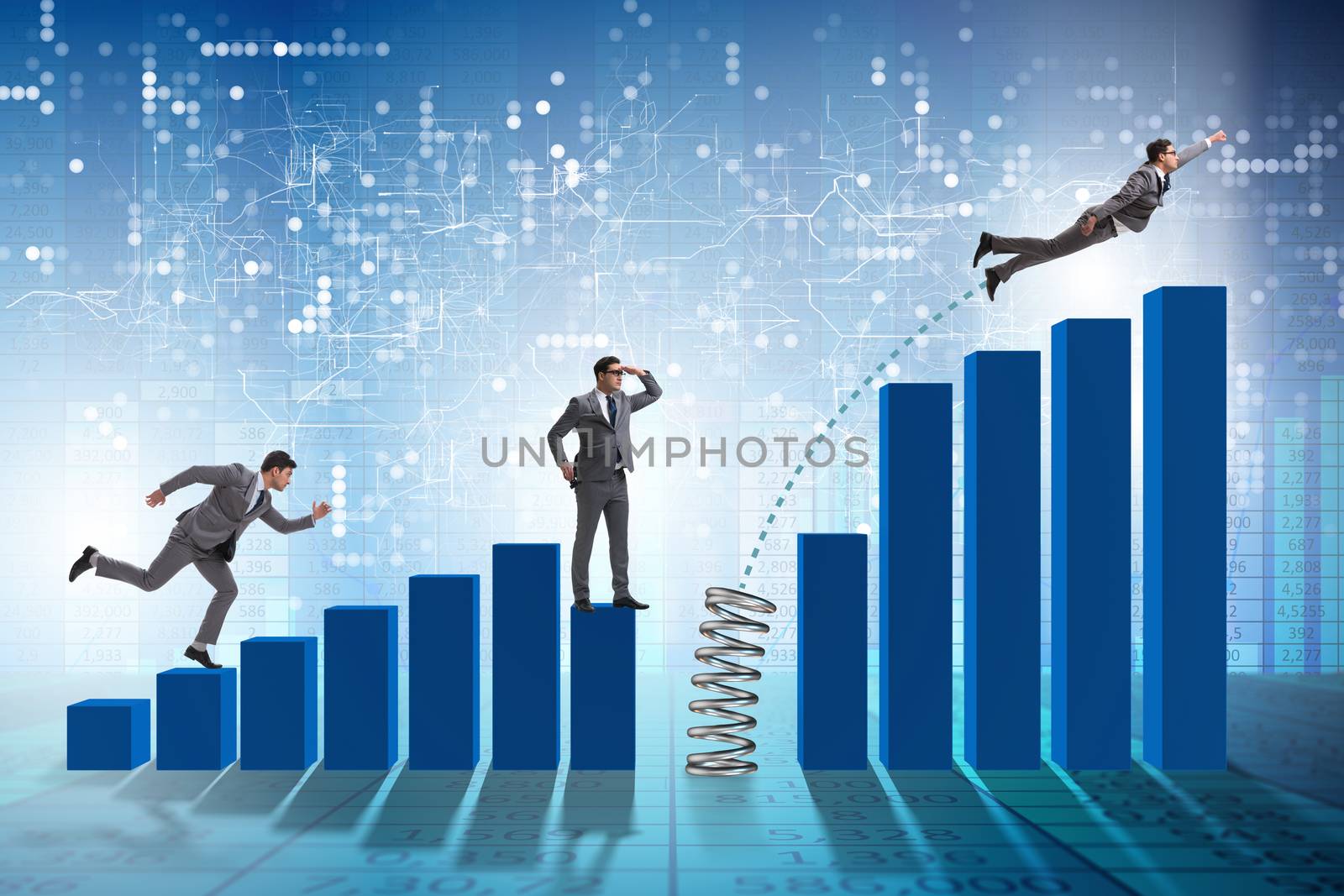 Business people jumping over bar charts