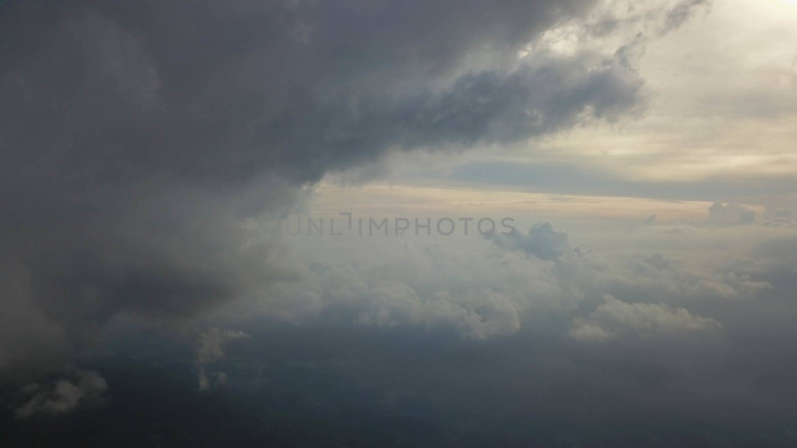 Rays of light shining through dark clouds for background by Sanatana2008