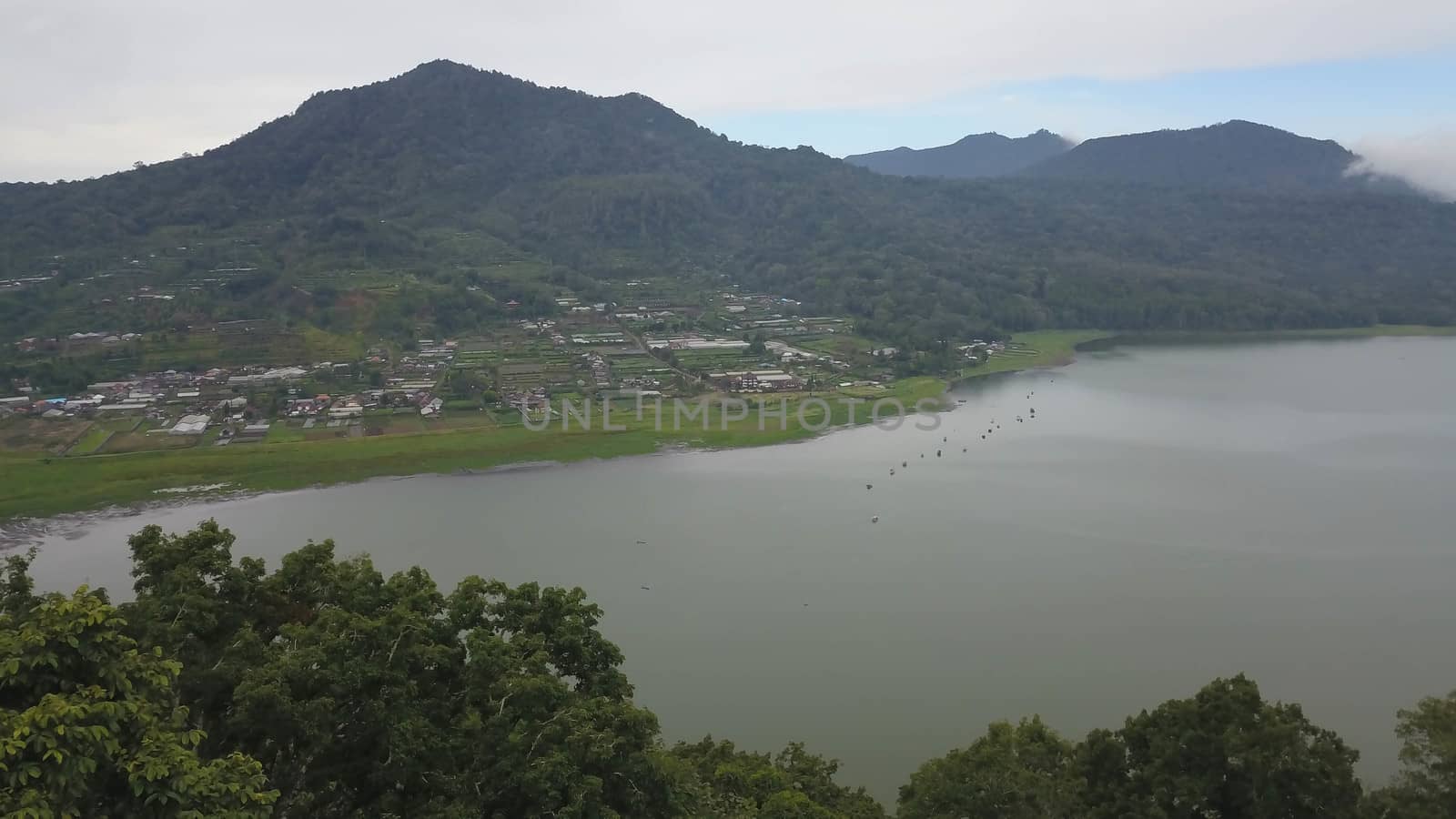 Beatiful aerial drone view over the lake. Lake and mountain view from a hill, Buyan Lake, Bali.
