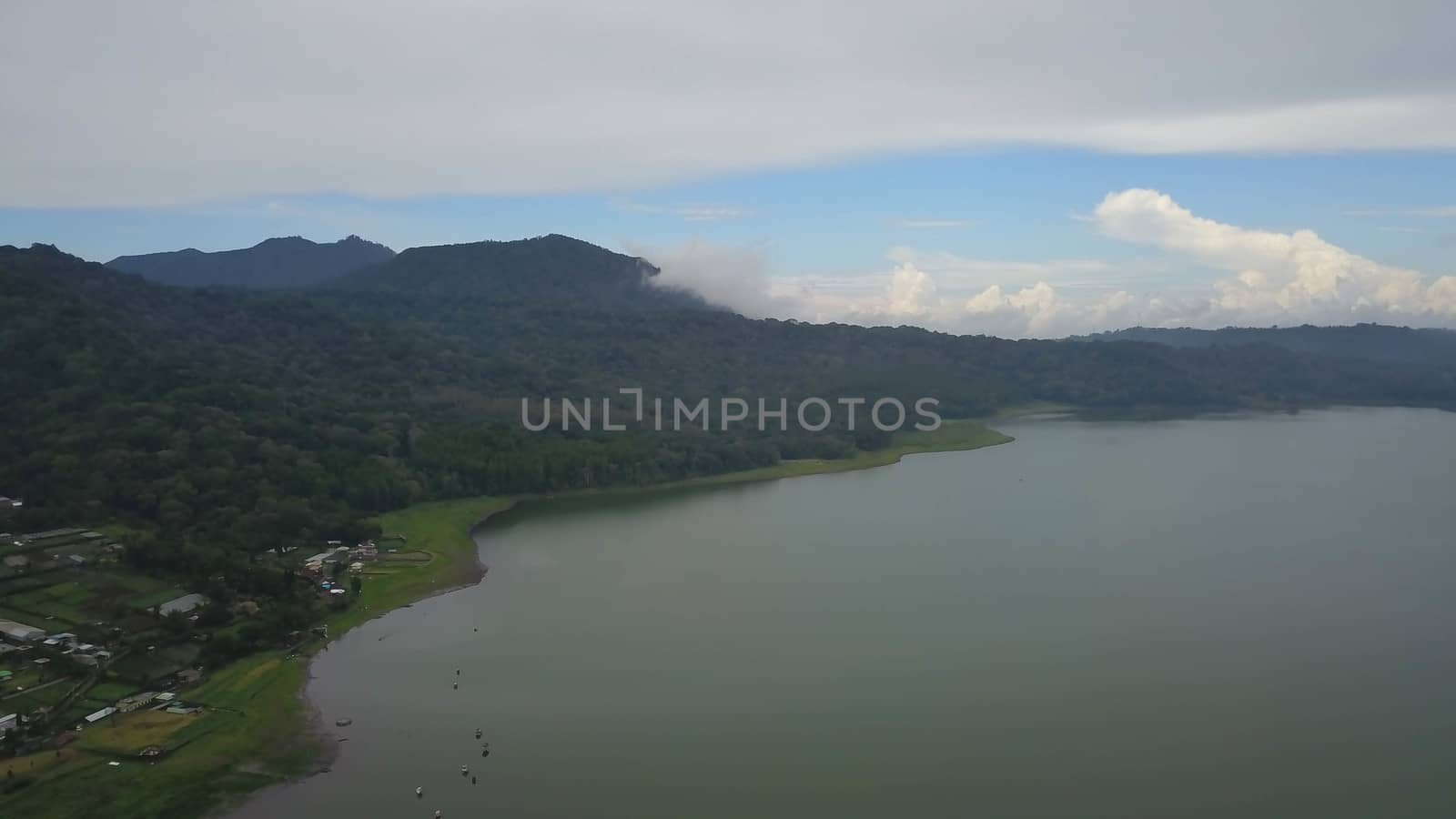 Aerial view to lake Buyan, caldera lake at Bali. Beautiful lake with turquoise water in the mountains of the island of Bali.