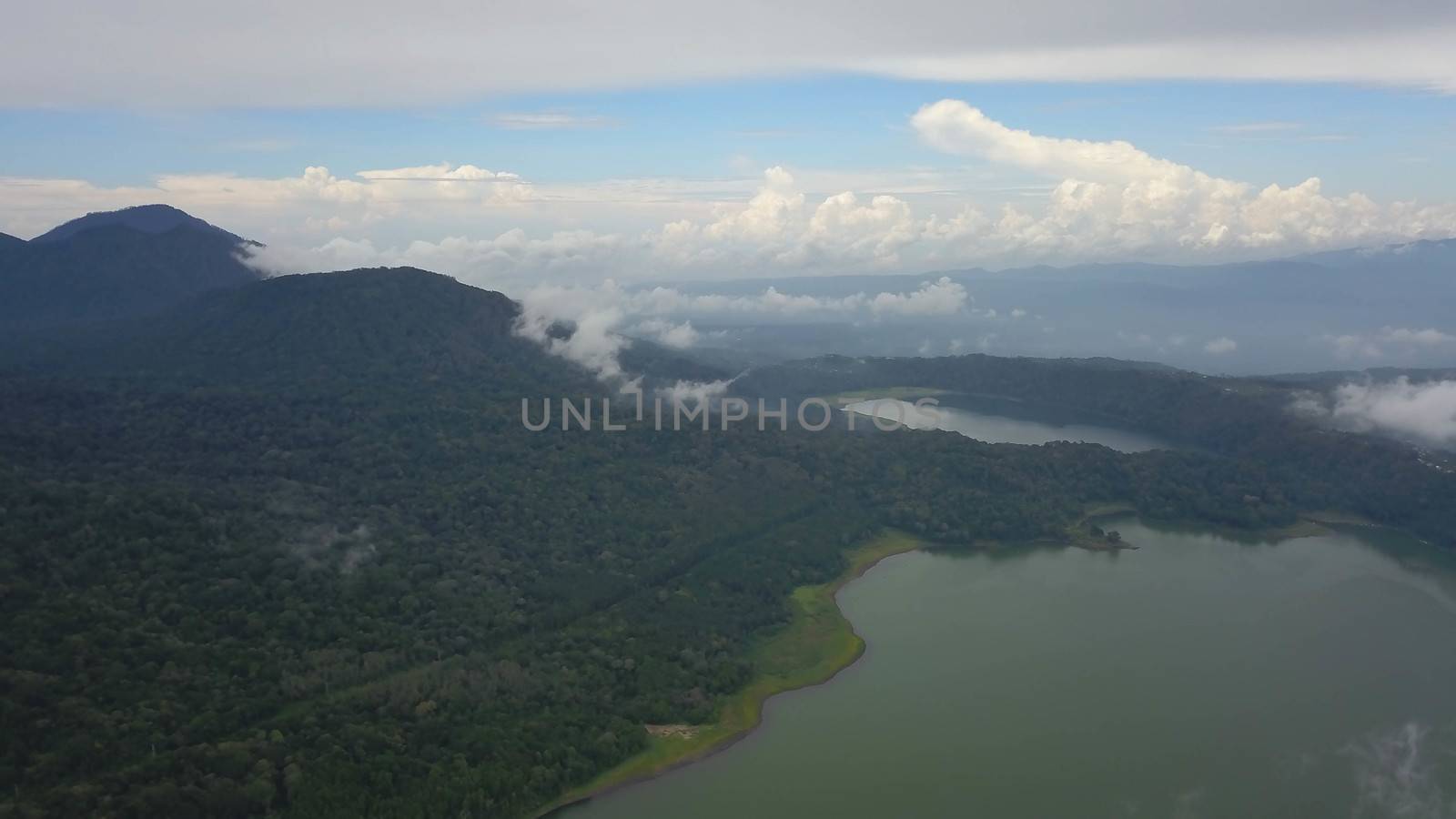 Aerial view of over Twin Lakes Buyan and Tamblingan in North Bali, Indonesia, a caldera lakes at Bali. Beautiful lakes with turquoise water in the mountains of the island of Bali. Landscape, lake.