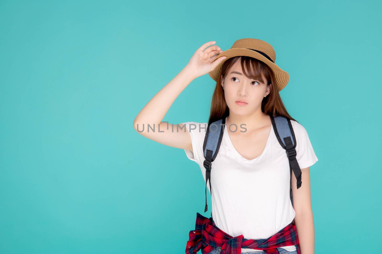 Beautiful young asian woman upset and worry travel summer trip in abroad isolated on blue background, tourist asia girl having problem and stress journey in vacation for leisure, holiday concept.