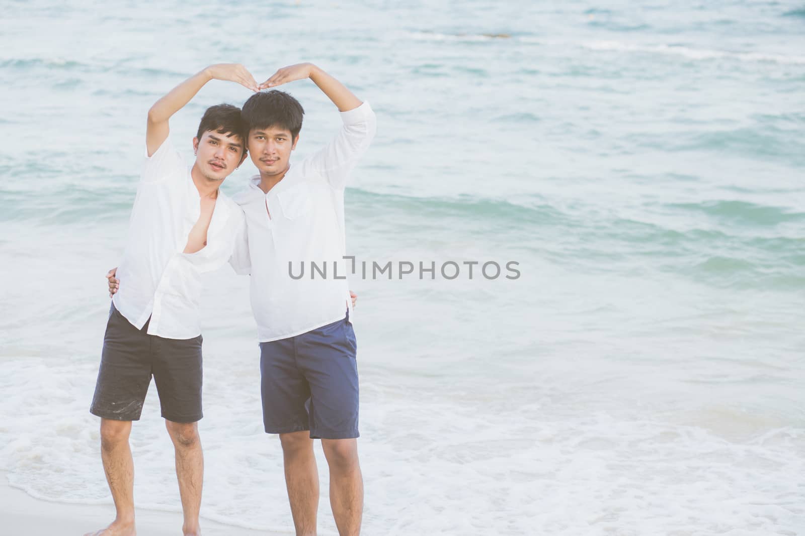 Homosexual portrait young asian couple stand gesture heart shape by nnudoo