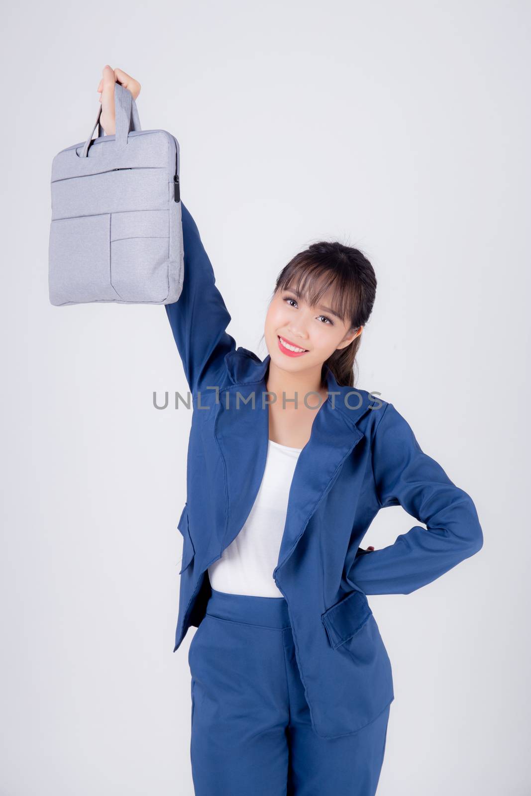 Beautiful portrait young business asian woman holding a briefcase portfolio isolated on white background, confident businesswoman walking and carrying document case of work, employee girl is cheerful.
