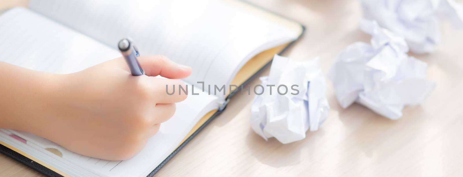 Closeup asian woman tired and stressed with writing overworked at desk, girl with worried not idea with notebook and crumpled paper at office, freelance and business concept, banner website.