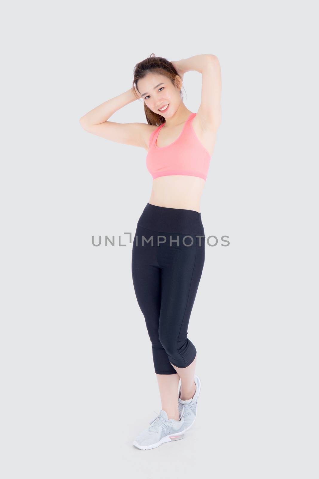 Beautiful portrait young asian woman standing workout stretch mu by nnudoo