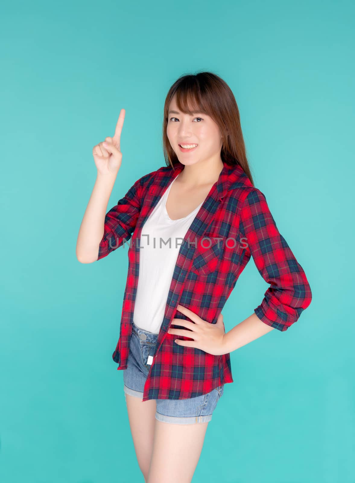 Beautiful portrait young asian woman smiling gesture pointing so by nnudoo