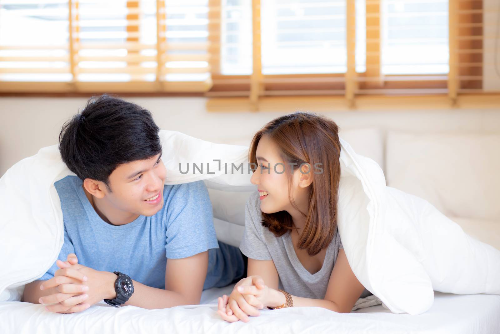 Beautiful portrait young asian couple relax and satisfied togeth by nnudoo