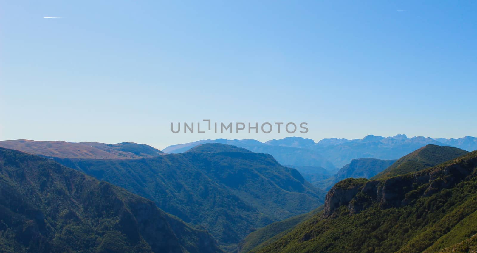 Banner of many mountain peaks and hills observed above the old Bosnian village of Lukomir. Mountain peaks and hills. Bjelasnica Mountain, Bosnia and Herzegovina.