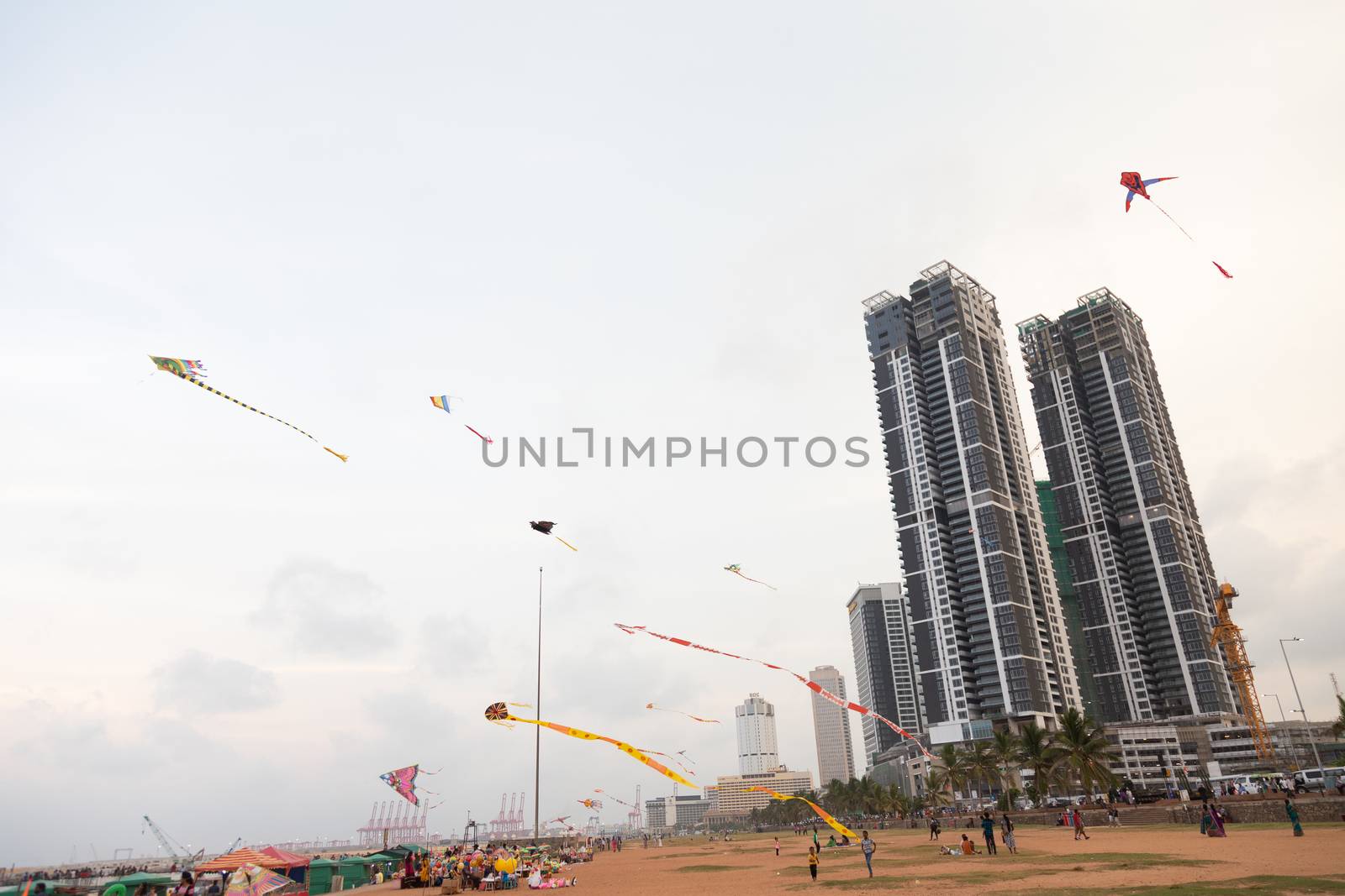 Colombo Sri Lanka 4.25.2018 People flying kites at sunset on Galle Fort Road seafront Colombo. High quality photo