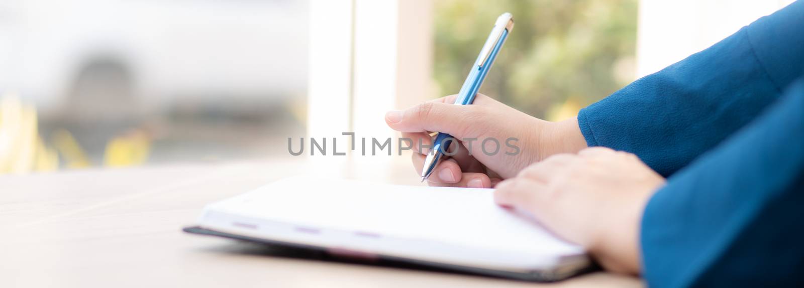 Closeup hand woman writer thinking idea and writing on notebook or diary with happy, lifestyle of asian girl is student, female planning working, education and business, concept.