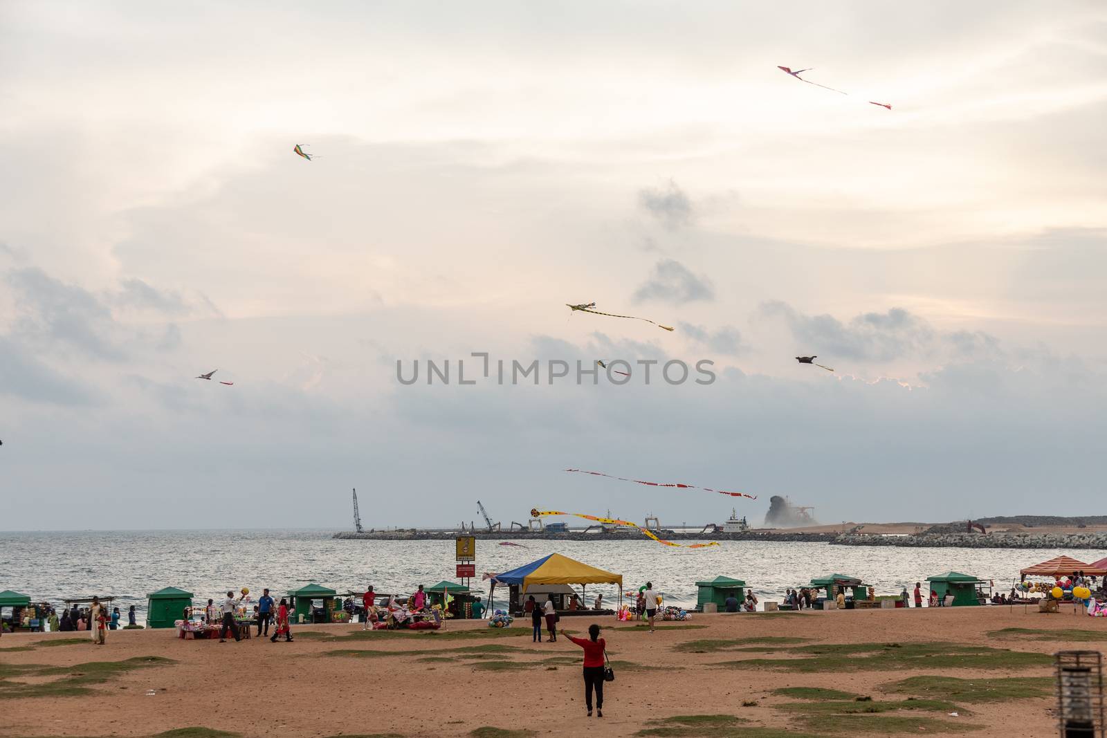 Colombo Sri Lanka 4.25.2018 People flying kites Galle fort road seafront sunset by kgboxford