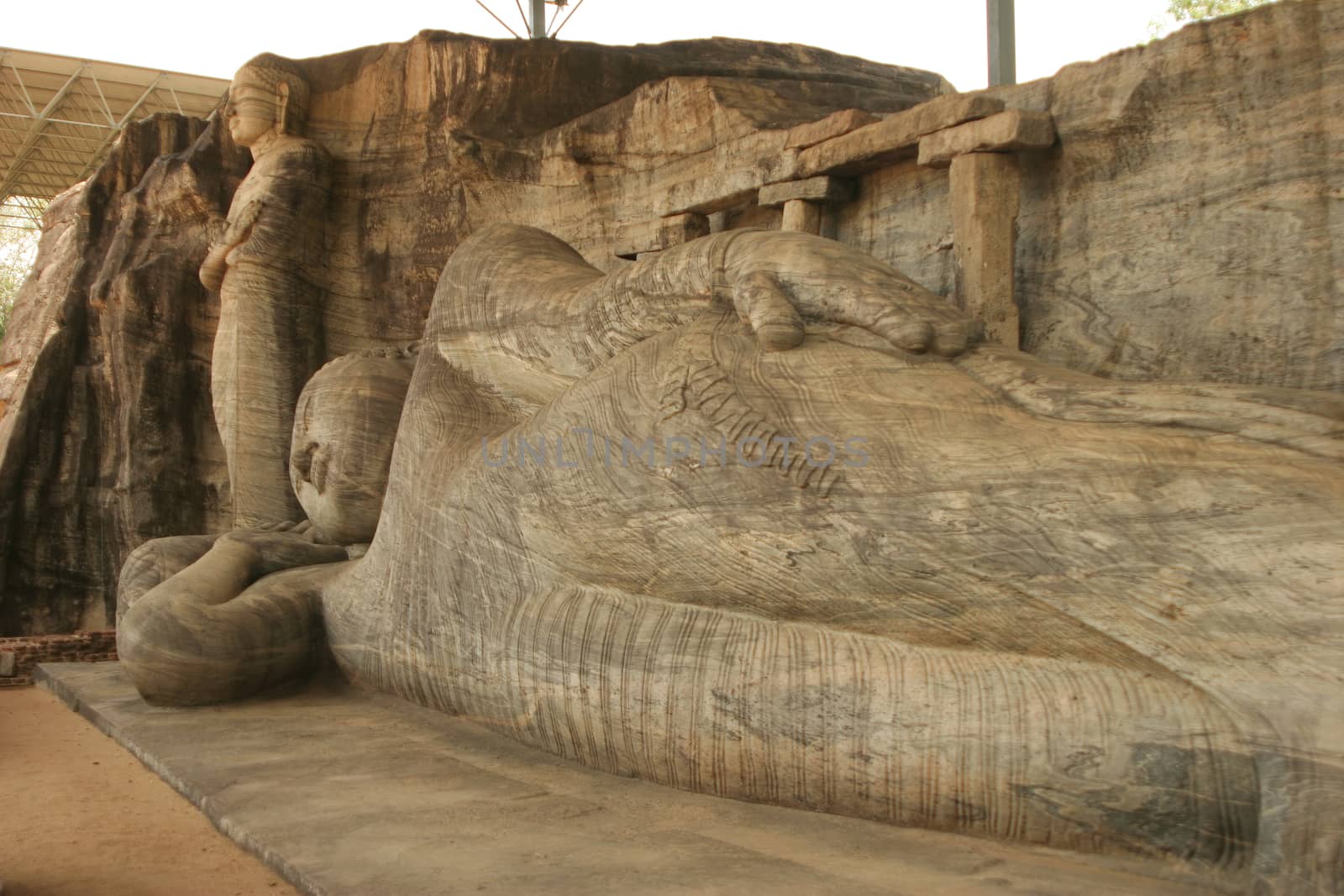 Polonnaruwa Sri Lanka Ancient ruins Statue of reclining Buddha laying down by kgboxford